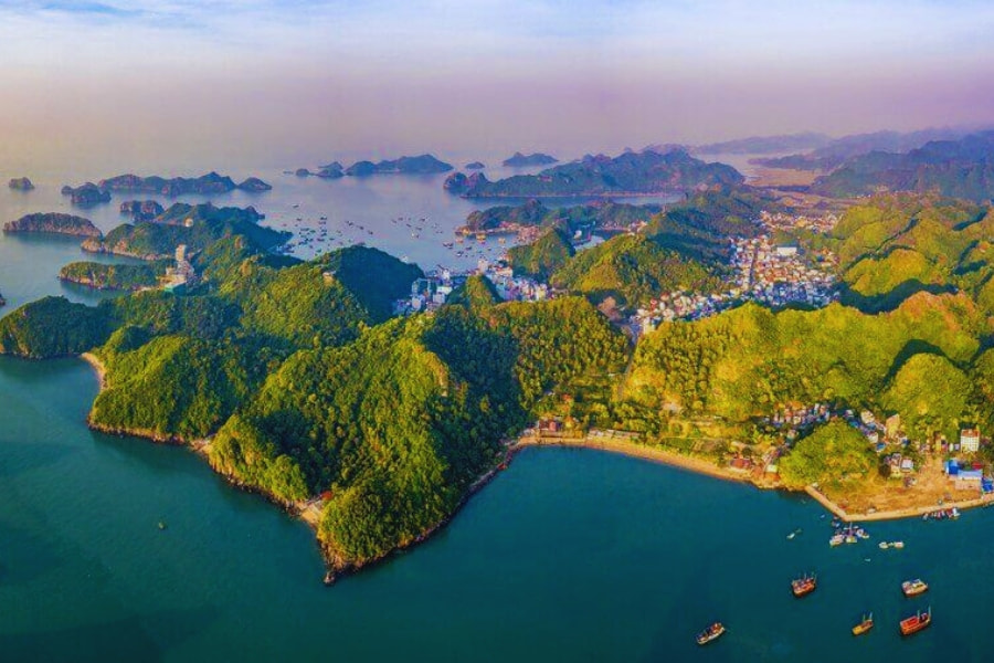 Aerial view of Cat Ba Island with green mountains and blue bays in Vietnam